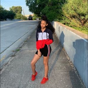 Tricolor jacket with red nike shoes